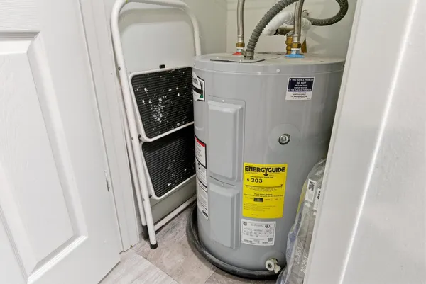 a utility room with closet dryer and washer