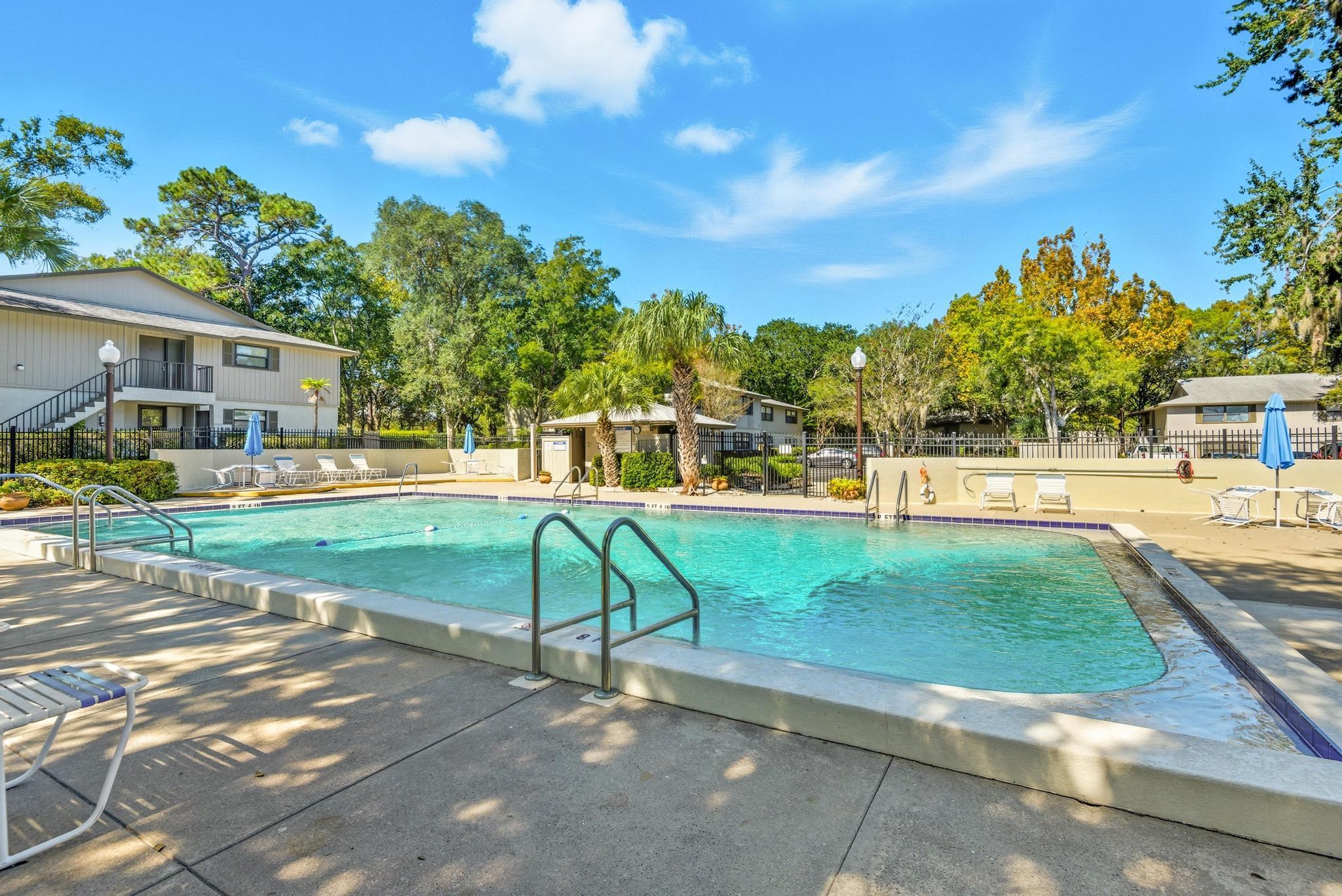 32 Navarra Court St. Augustine Shores, FL 32086 - Photo 37 of 40 a view of yard with swimming pool and trees