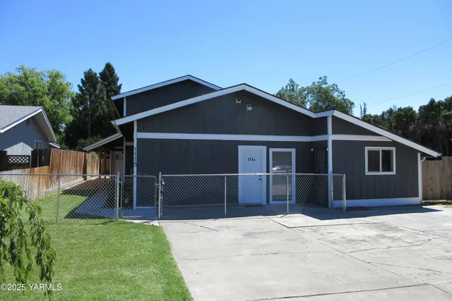 a front view of a house with garage