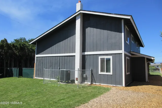 a house with yard in front of it