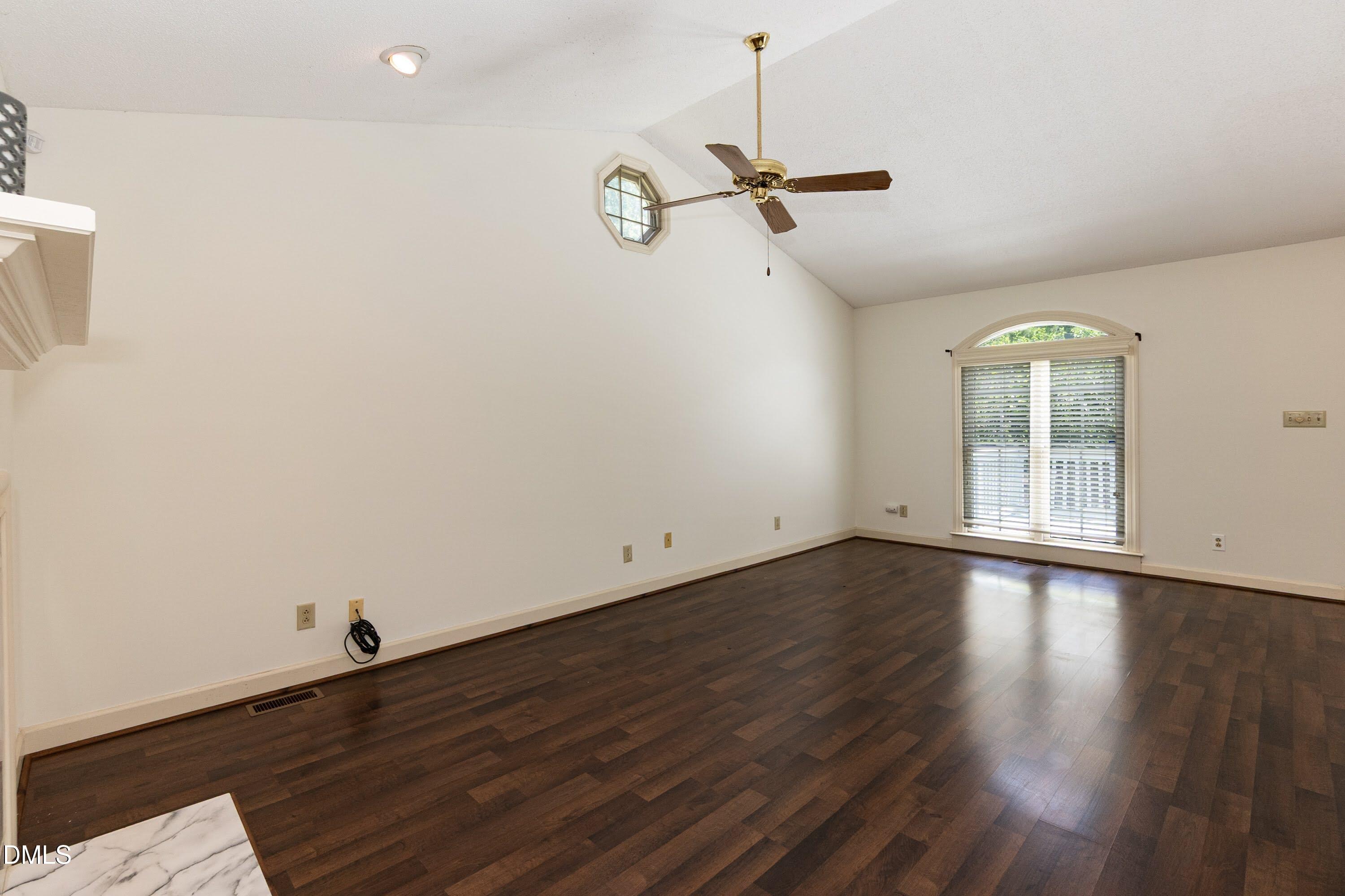 5604 Spring Pines Way Raleigh, NC 27616 - Photo 3 of 22 a view of empty room with wooden floor and fan