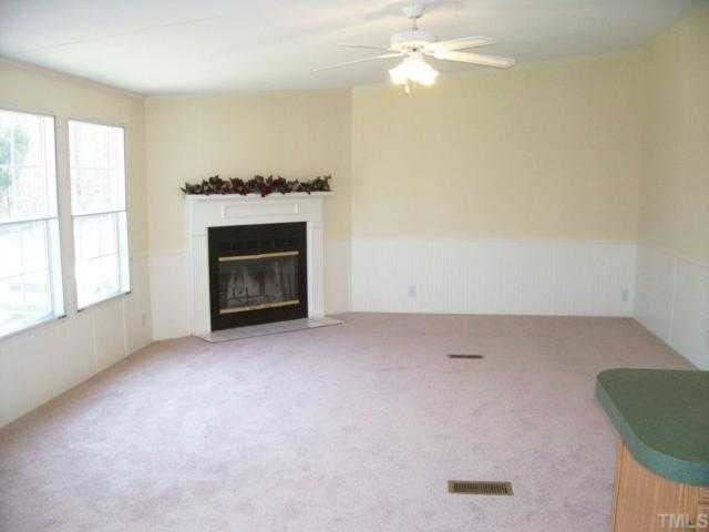 9580 Cornwall Road Oxford, NC 27565 - Photo 4 of 12 Family room with a wood burning fireplace.