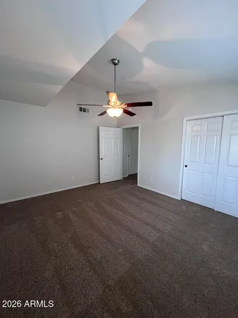 a view of a livingroom with a chandelier fan