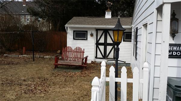 40 Wrona Street Springfield, MA 01151 - Photo 3 of 6 a front view of a house with garden