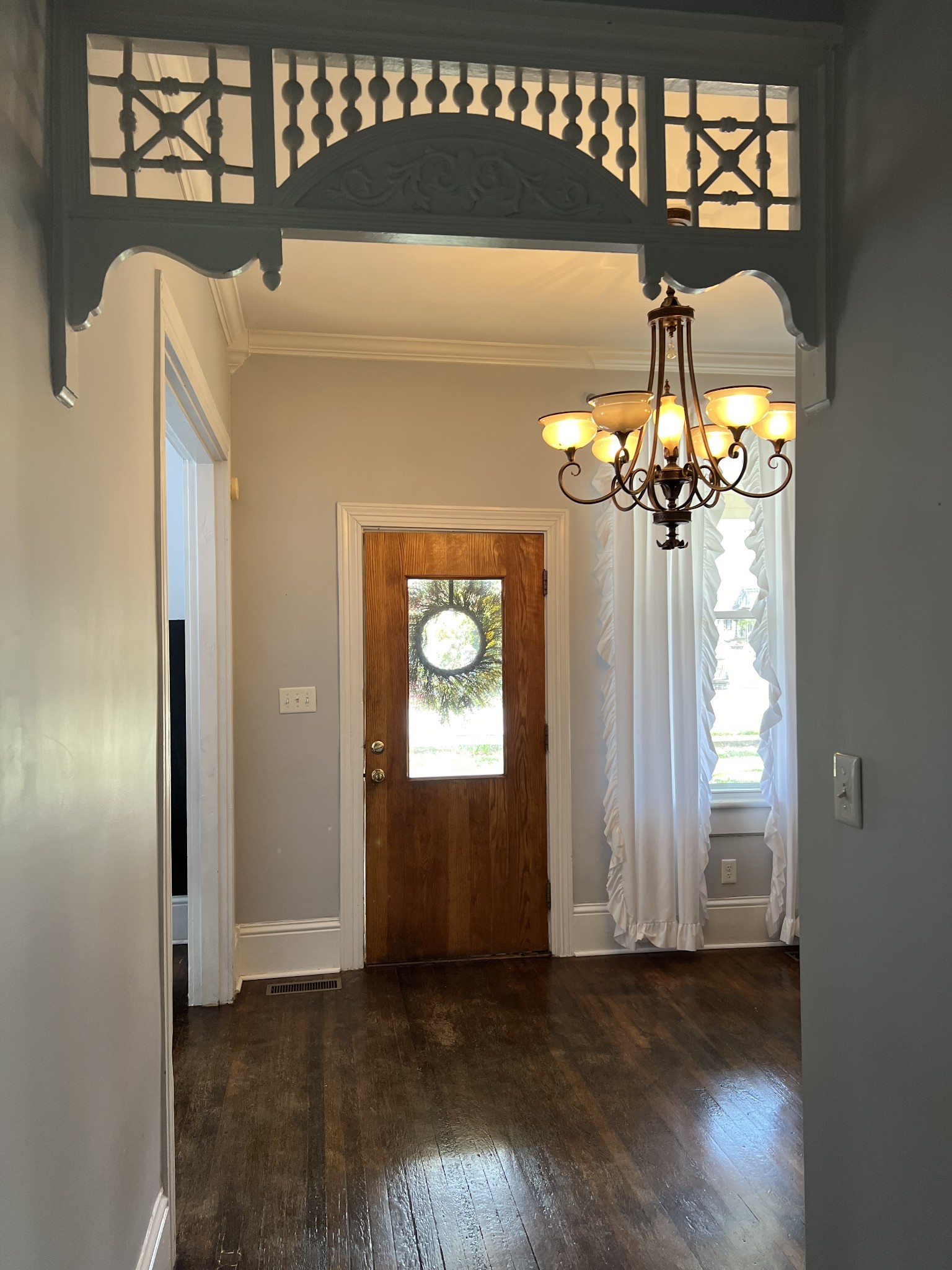 201 Pleasant Street Mount Pleasant, TN 38474 - Photo 7 of 38 a view of a chandelier fan and wooden floor