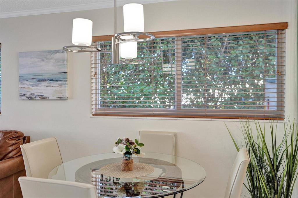 505 North Riverside Drive, Unit 7 Pompano Beach, FL 33062 - Photo 12 of 43 a bathroom with a sink and a mirror