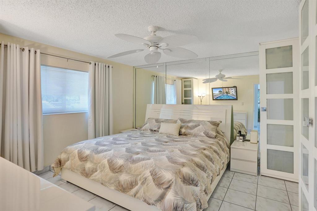 505 North Riverside Drive, Unit 7 Pompano Beach, FL 33062 - Photo 13 of 43 a large white bed in a white room