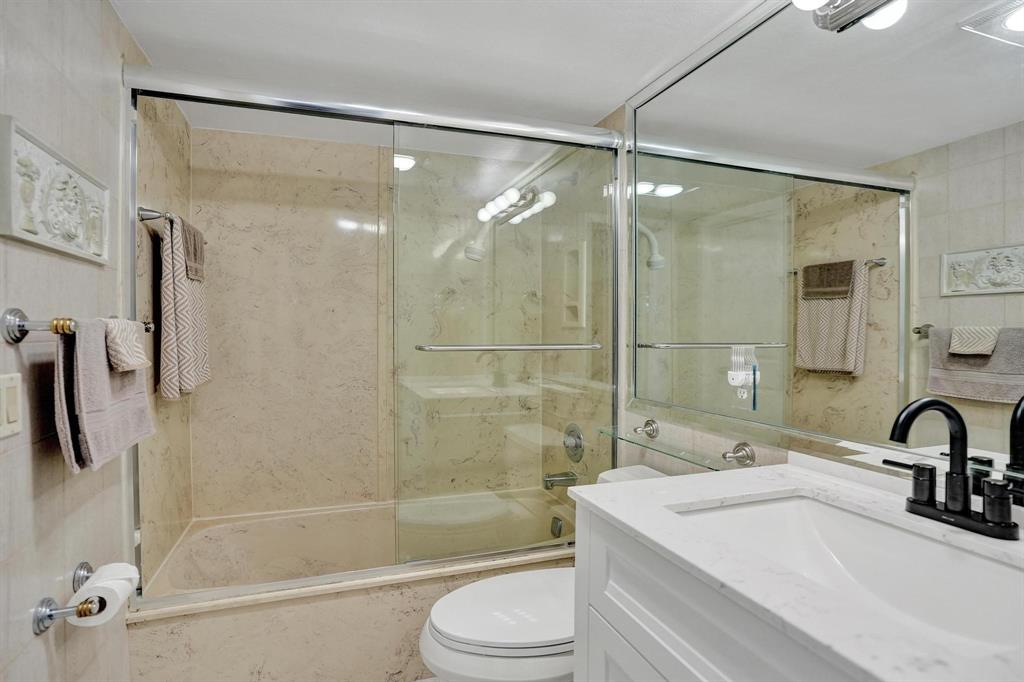 505 North Riverside Drive, Unit 7 Pompano Beach, FL 33062 - Photo 16 of 43 a bathroom with a sink mirror toilet and bathtub
