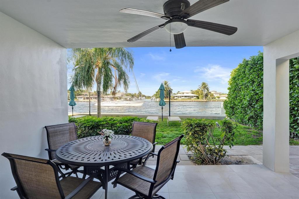 505 North Riverside Drive, Unit 7 Pompano Beach, FL 33062 - Photo 17 of 43 a view of a patio with table and chairs and potted plants