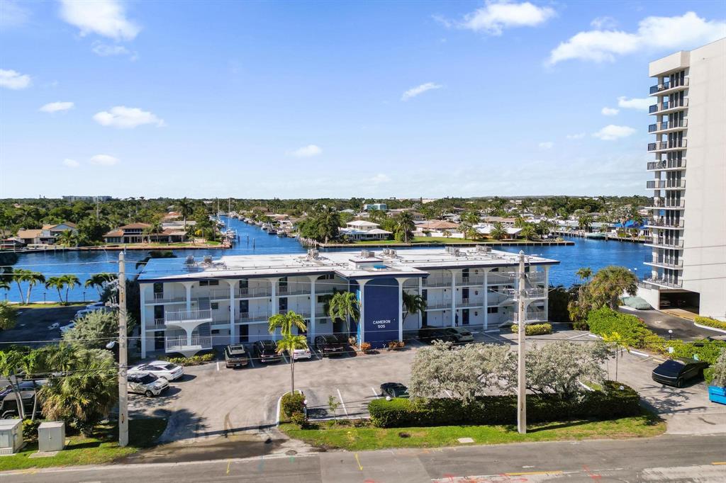 505 North Riverside Drive, Unit 7 Pompano Beach, FL 33062 - Photo 31 of 43 a front view of a building with outdoor space and sitting area