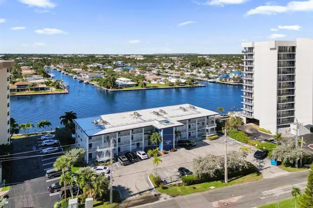 a view of a lake with tall buildings