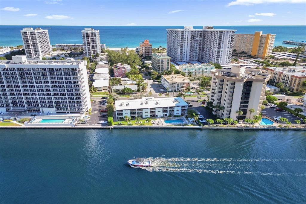 505 North Riverside Drive, Unit 7 Pompano Beach, FL 33062 - Photo 34 of 43 a view of a lake with tall buildings