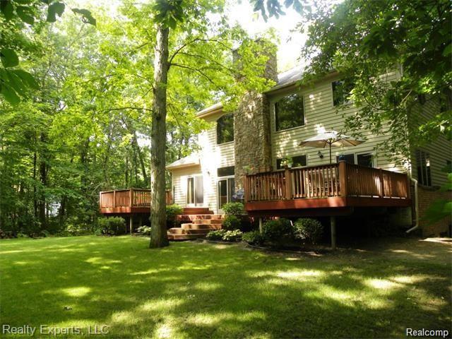 6328 Stofer Road Chelsea, MI 48118 - Photo 22 of 29 22 back exterior.jpg