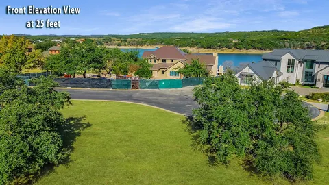 an aerial view of residential house with outdoor space and lake view