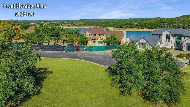 an aerial view of residential house with outdoor space and lake view