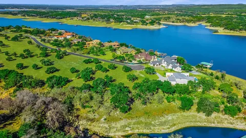 a view of a lake with a house in the background