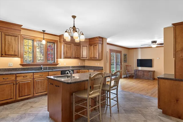 a kitchen with granite countertop a sink and counter space
