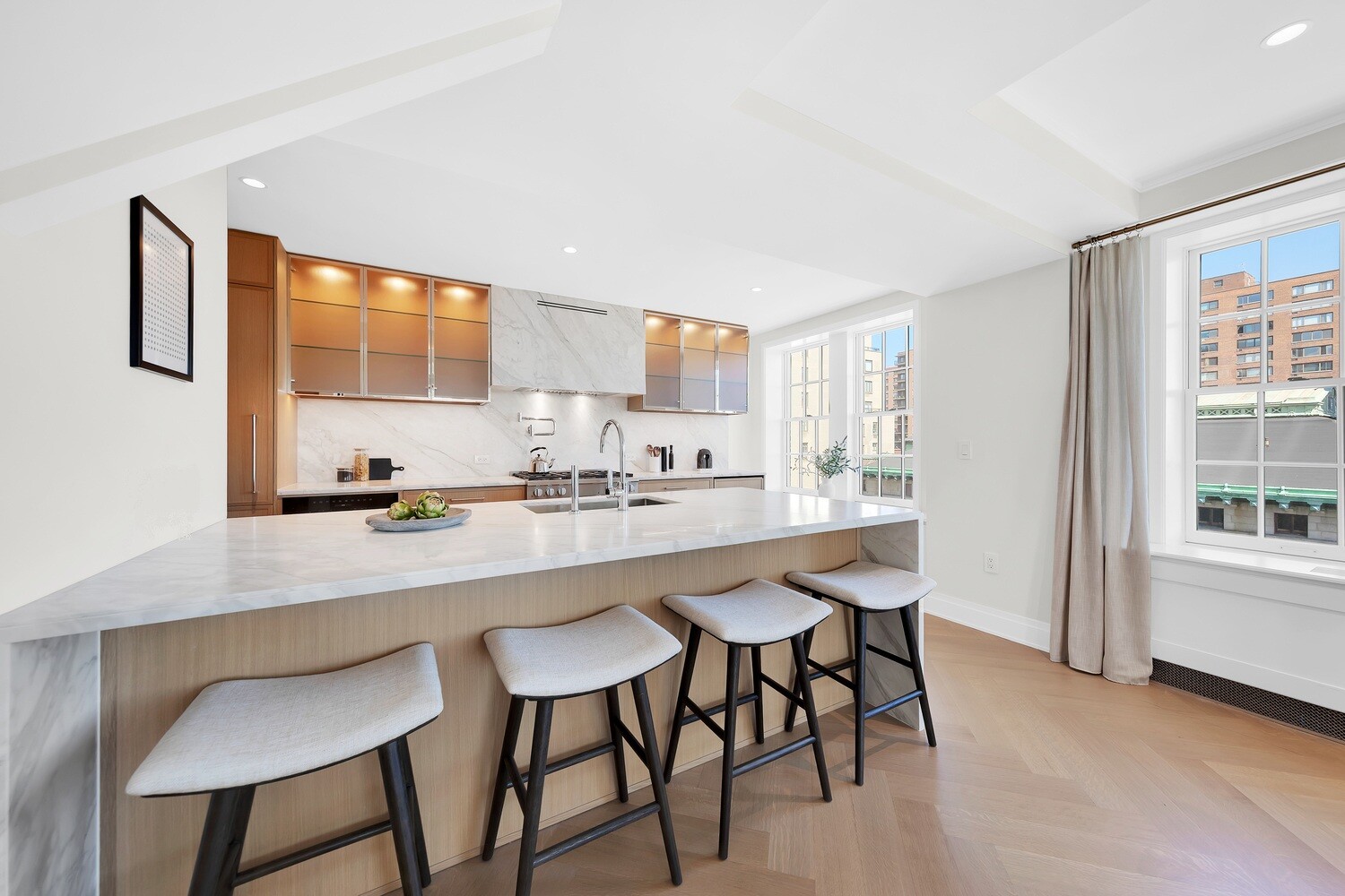 360 Central Park West, Unit 8A/9A Manhattan, NY 10025 - Photo 4 of 17 a kitchen with a sink and chairs