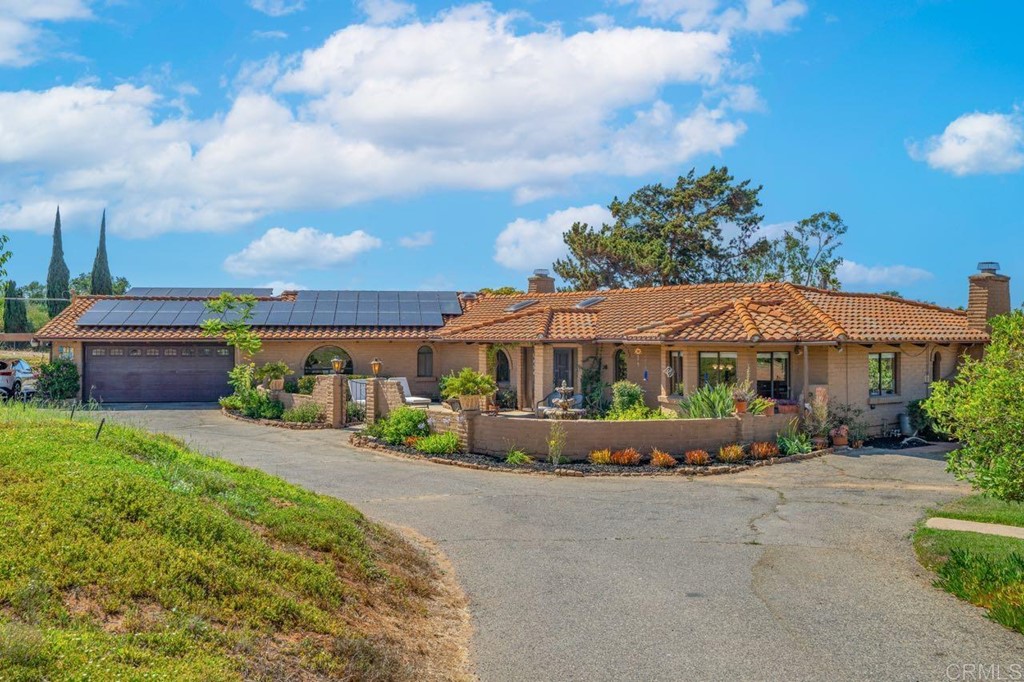 4057 Ladera Vista Road Fallbrook, CA 92028 - Photo 1 of 1 a front view of a house with garden