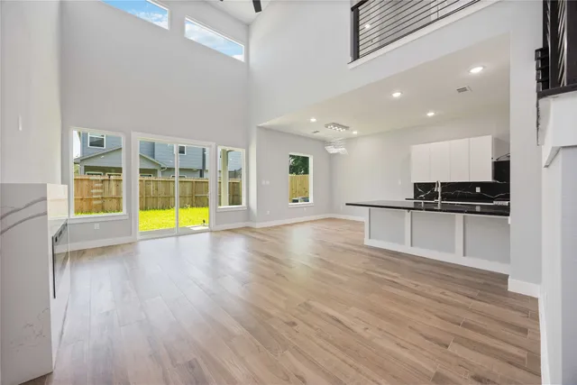 a view of a kitchen with a sink and a stove top oven