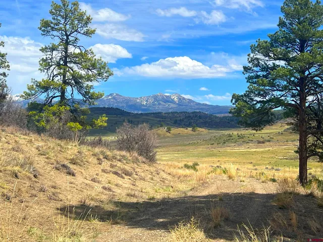 a view of a lake with sunset