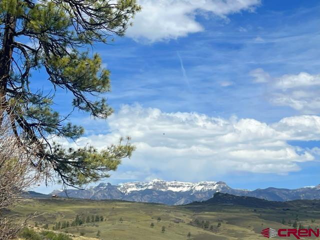 223 Spg Vly Rnch Road Chromo, CO 81128 - Photo 25 of 32 a view of a lake with houses in the back