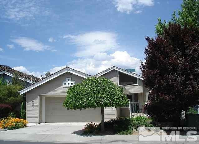 3313 Spring Creek Circle Reno, NV 89509 - Photo 1 of 1 a front view of a house with garden