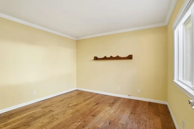 a view of a workspace with furniture and wooden floor