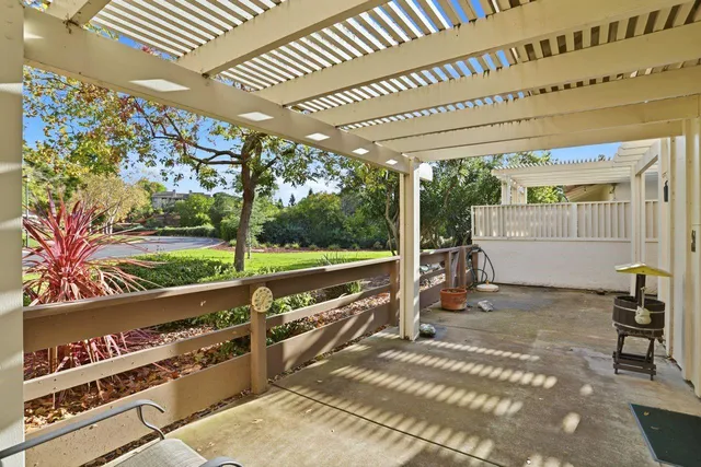 a view of yard with swimming pool and trees