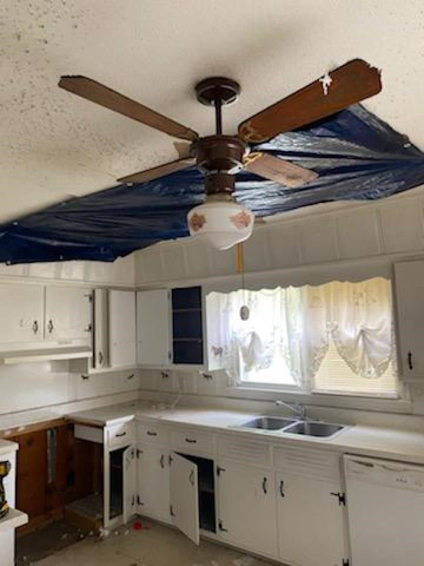 700 Pilgrims Rest Road McKenzie, TN 38201 - Photo 2 of 13 a kitchen with a sink and cabinets