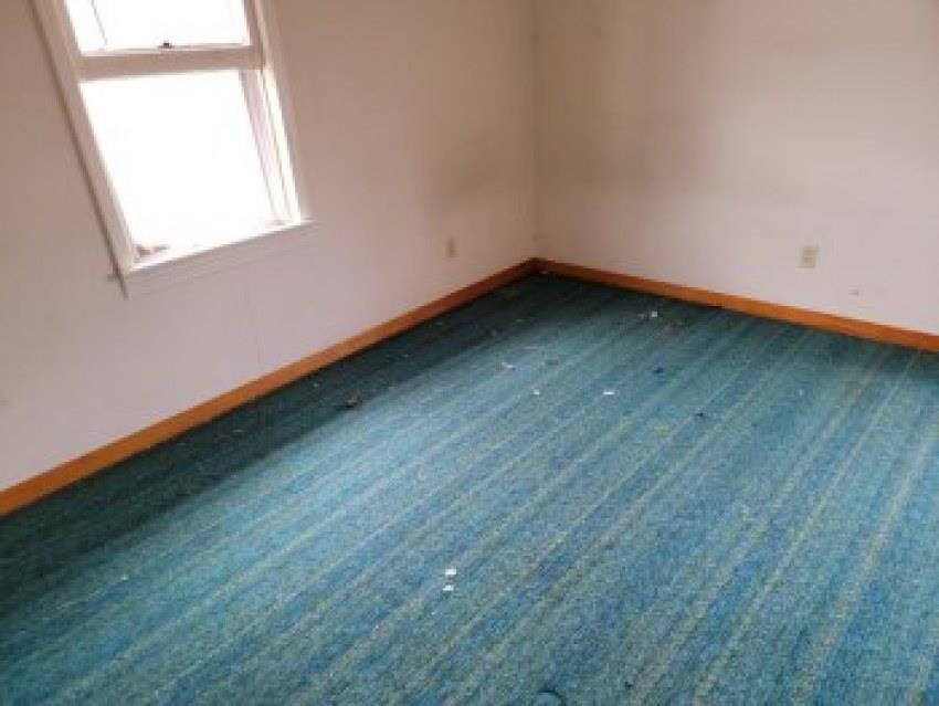700 Pilgrims Rest Road McKenzie, TN 38201 - Photo 10 of 13 an empty room with wooden floor and windows