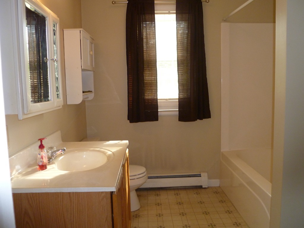 61 O'Neil Road Warren, MA 01092 - Photo 12 of 21 a bathroom with a sink a toilet and mirror