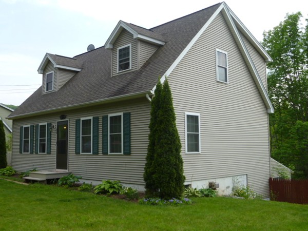 61 O'Neil Road Warren, MA 01092 - Photo 3 of 21 a front view of a house with a garden