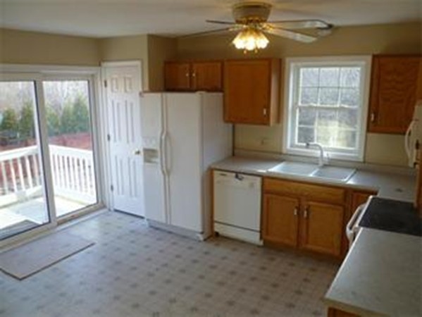 61 O'Neil Road Warren, MA 01092 - Photo 6 of 21 a kitchen with sink cabinets and window