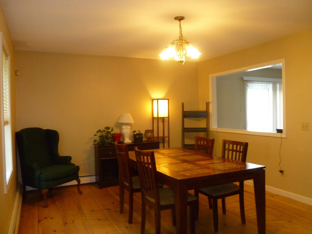 61 O'Neil Road Warren, MA 01092 - Photo 7 of 21 a view of a dining room with furniture and wooden floor
