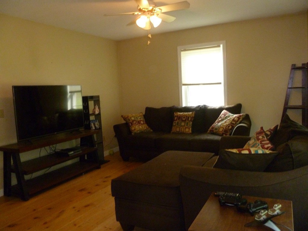 61 O'Neil Road Warren, MA 01092 - Photo 9 of 21 a living room with furniture and a flat screen tv
