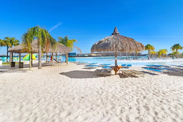 a view of a water fountain and a yard in the back