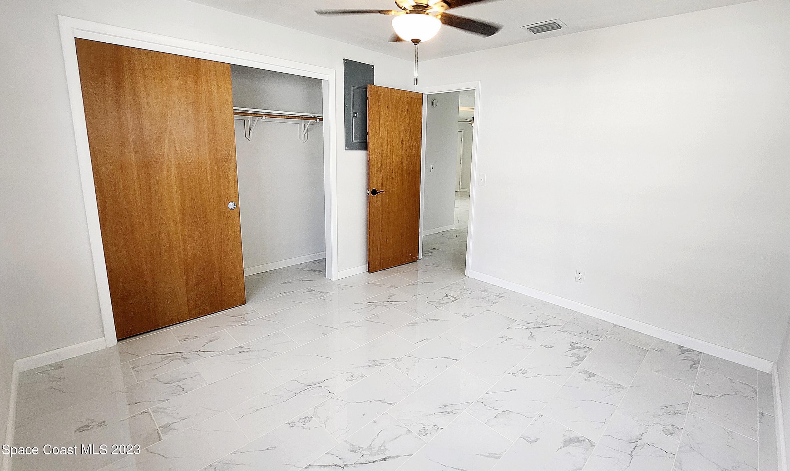 925 Gulfstream Avenue Sebastian, FL 32958 - Photo 12 of 19 an empty room with a ceiling fan