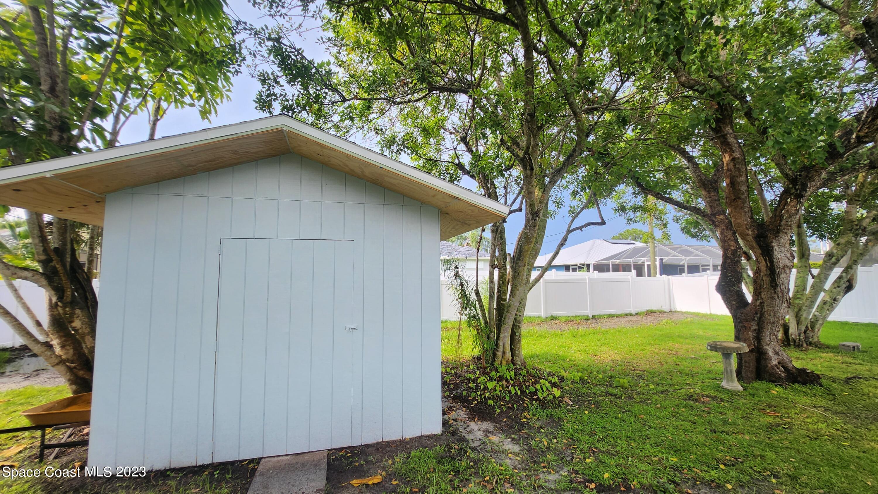 925 Gulfstream Avenue Sebastian, FL 32958 - Photo 17 of 19 a yellow house with tree in front of it