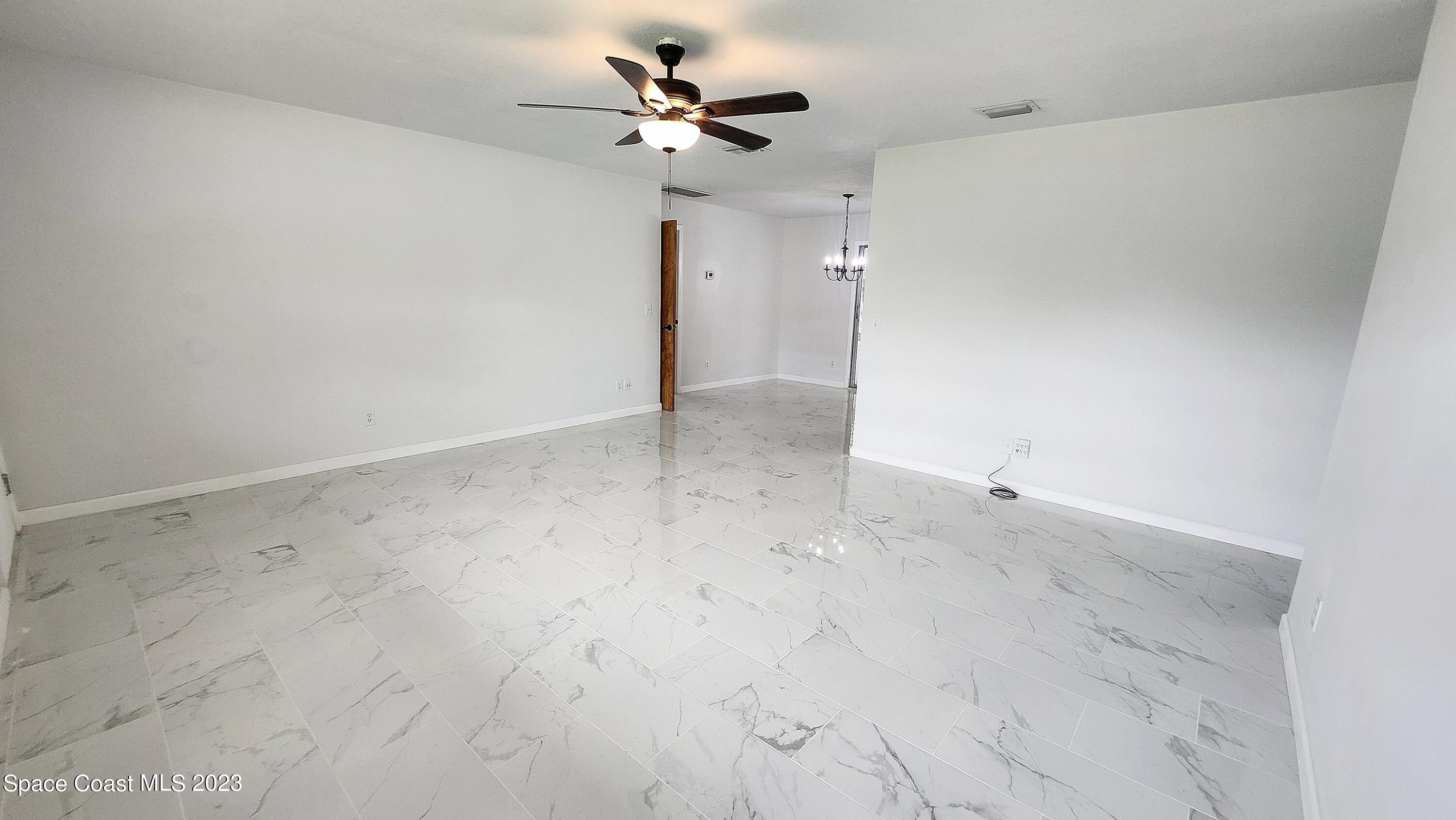 925 Gulfstream Avenue Sebastian, FL 32958 - Photo 4 of 19 a view of a big room with carpet