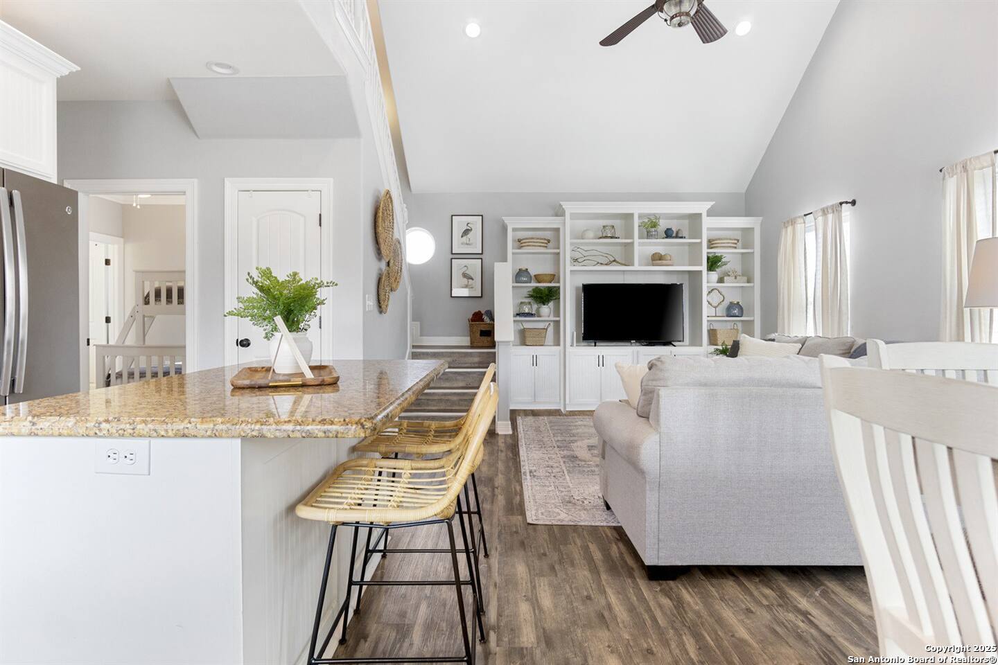 972 Surf Road Crystal Beach, TX 77650 - Photo 3 of 18 a living room with furniture wooden floor and flat screen tv