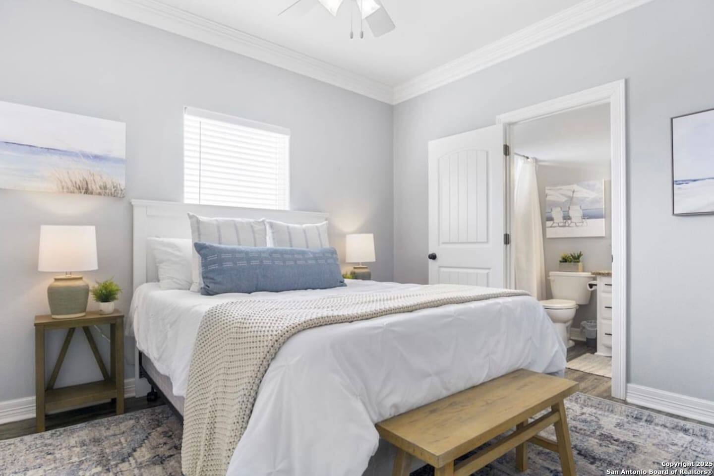 972 Surf Road Crystal Beach, TX 77650 - Photo 7 of 18 a bedroom with a bed and window