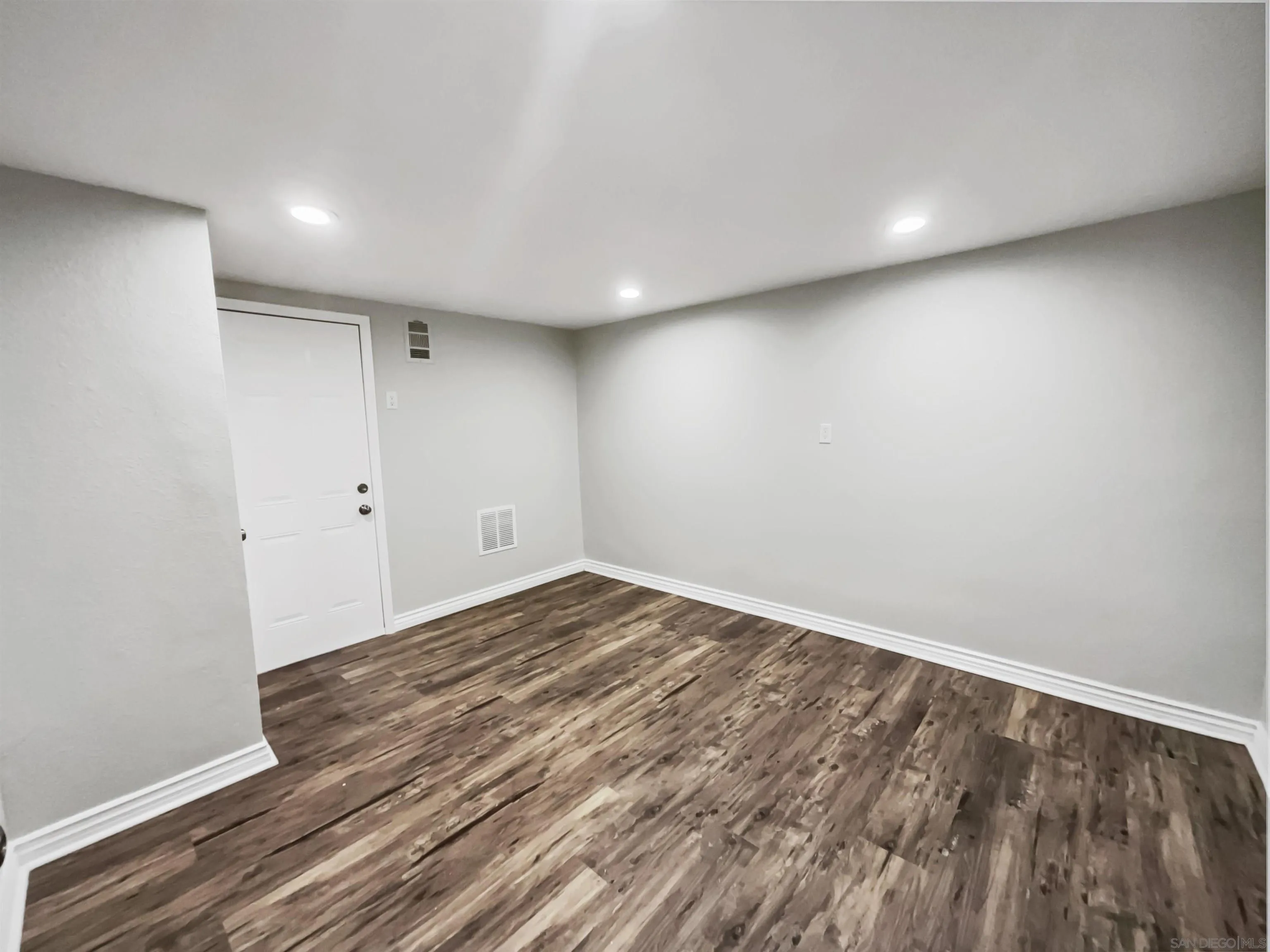 212 South Wisconsin Street Fallbrook, CA 92028 - Photo 14 of 16 a view of empty room with wooden floor