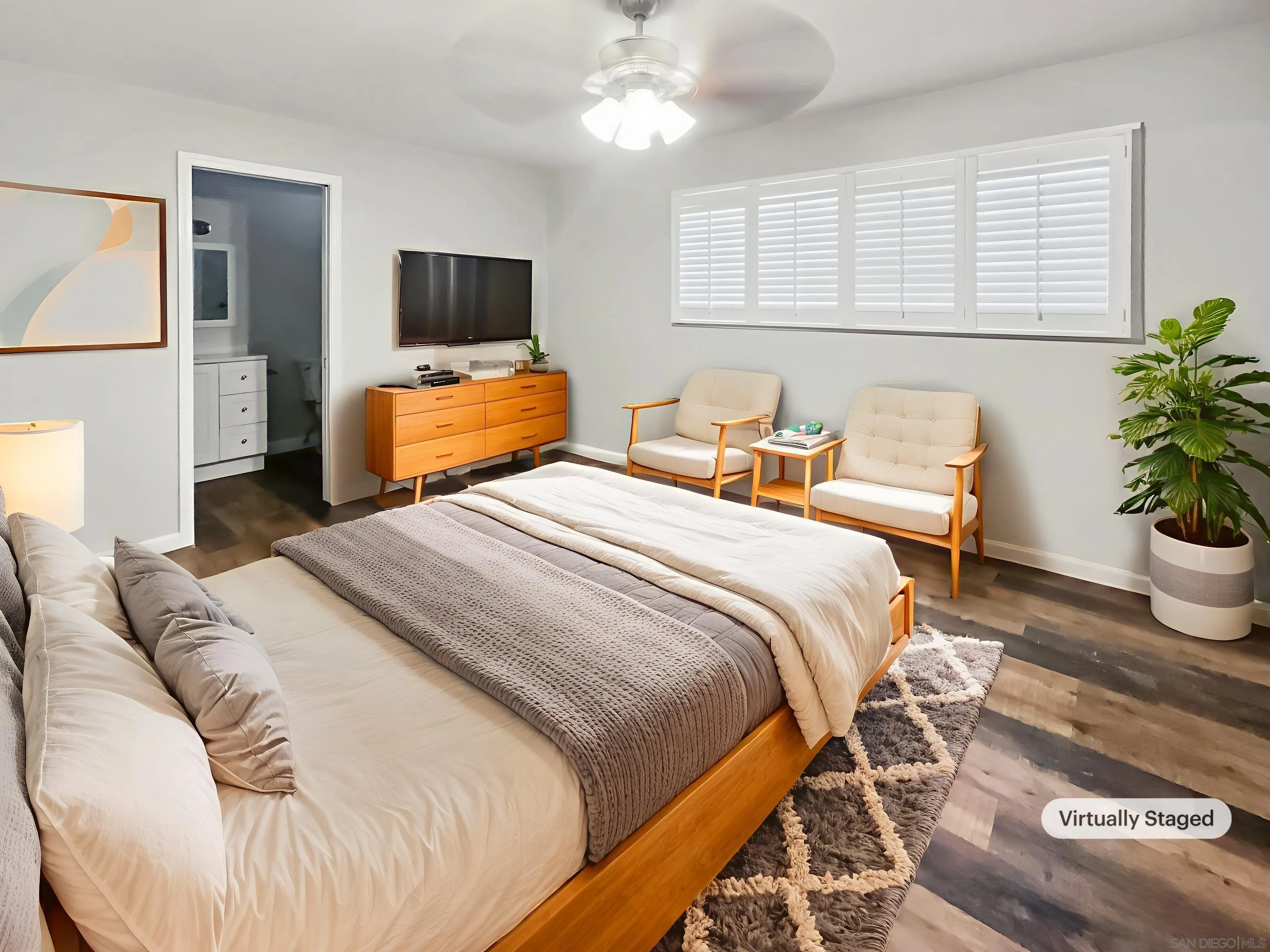 212 South Wisconsin Street Fallbrook, CA 92028 - Photo 4 of 16 a bedroom with a bed and a potted plant