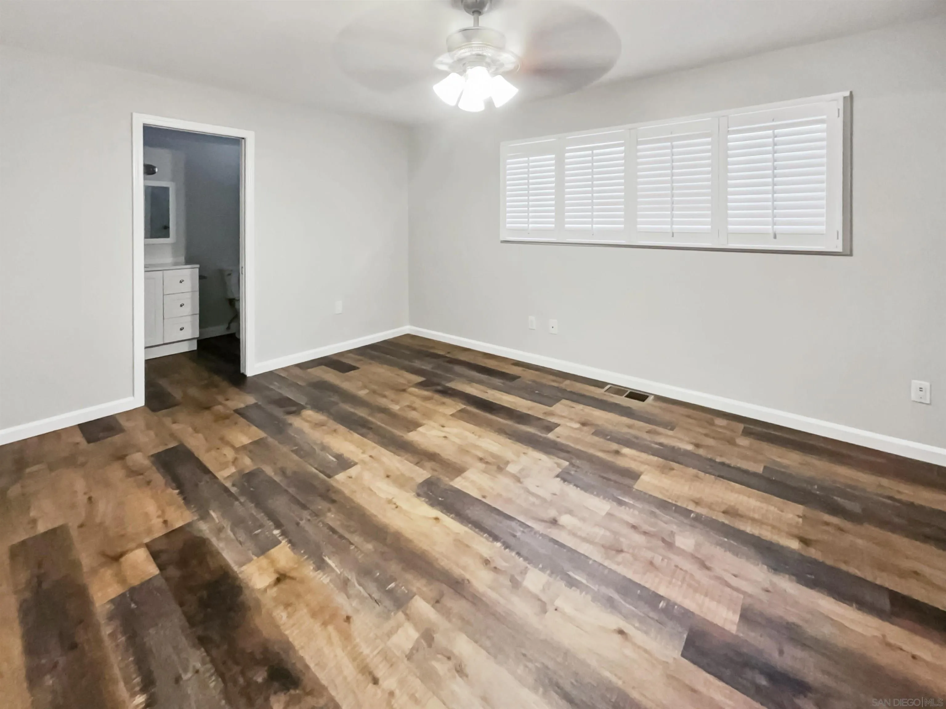 212 South Wisconsin Street Fallbrook, CA 92028 - Photo 5 of 16 a view of empty room with wooden floor