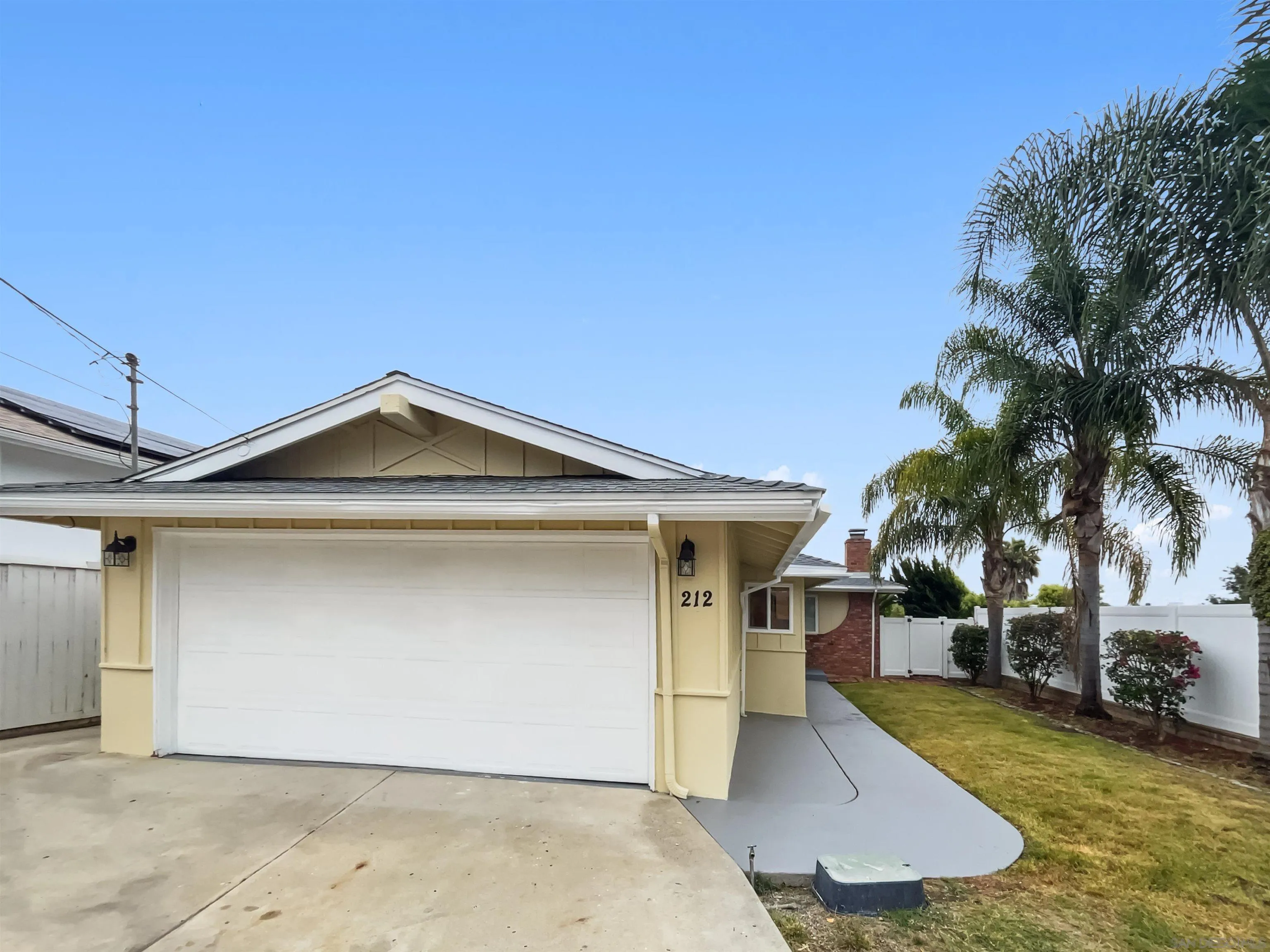 212 South Wisconsin Street Fallbrook, CA 92028 - Photo 9 of 16 a front view of a house with a yard