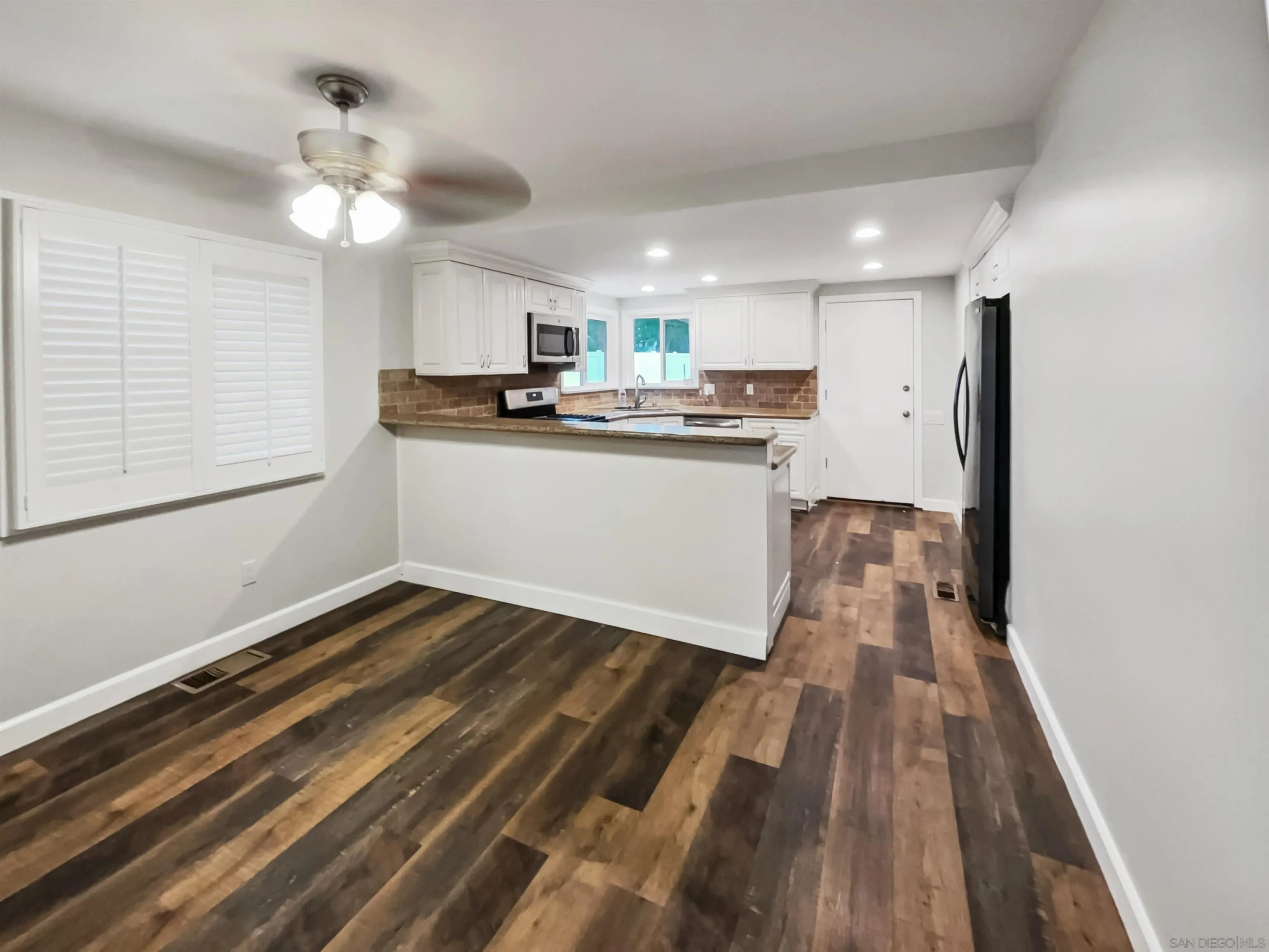 212 South Wisconsin Street Fallbrook, CA 92028 - Photo 10 of 16 a kitchen with a sink and refrigerator