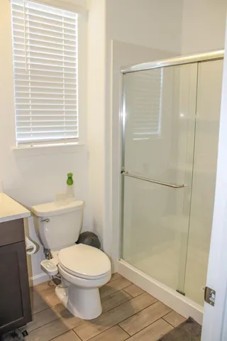 a bathroom with a sink toilet and a mirror