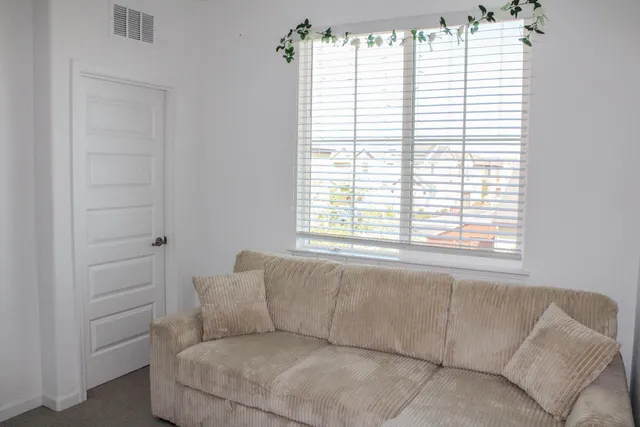 a bedroom with a bed and a closet