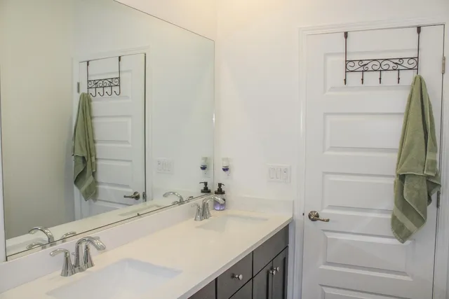 a bedroom with a bed that has a blanket on it and a window